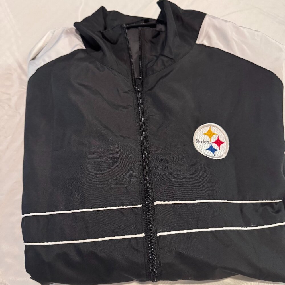 Official Pittsburgh Steelers full-zip windbreaker jacket by Dunbrooke in a sleek